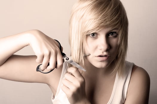 young woman with scissors photo