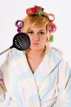 funny housewife with curlers and skimmer photo
