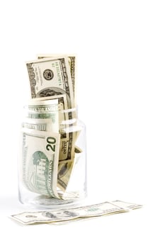money in glass jar photo