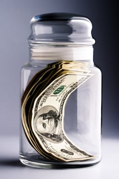 money in glass jar photo
