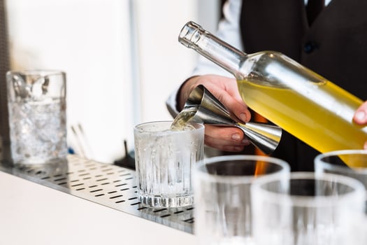 Cocktail preparation at a stylish bar during an evening tasting event photo