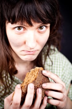 beggar with a piece of bread photo