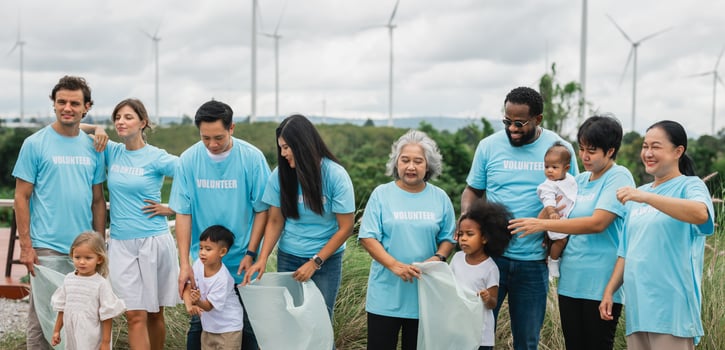group of people wearing blue shirts with the word volunteer on them photo