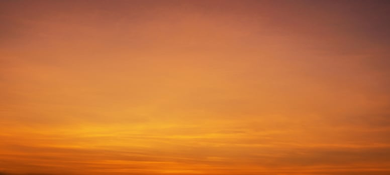 beautiful orange sky with a few clouds photo