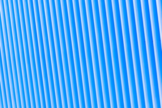 Detail of blue striped metal facade for background photo