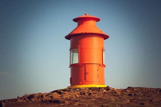 Red Lighthouse on a hill, Iceland photo