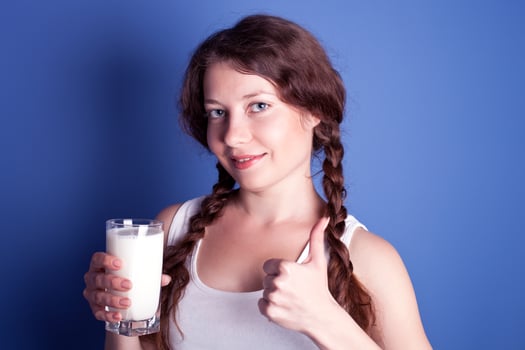 woman enjoying a glass of milk photo