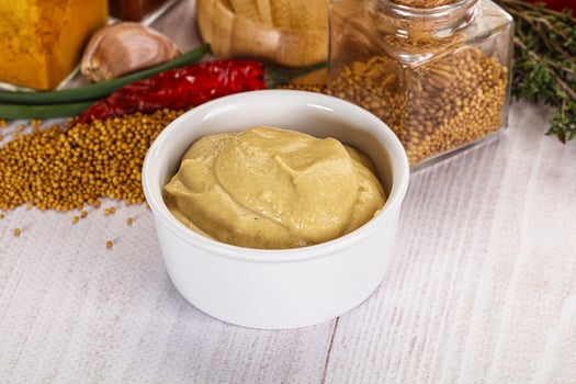 Dijon mustard sauce in the bowl photo