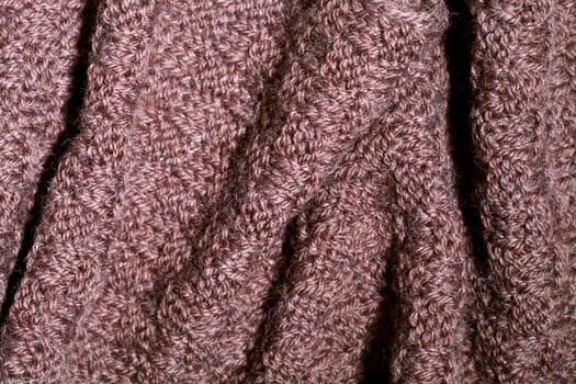 Knitted brown scarf texture. photo