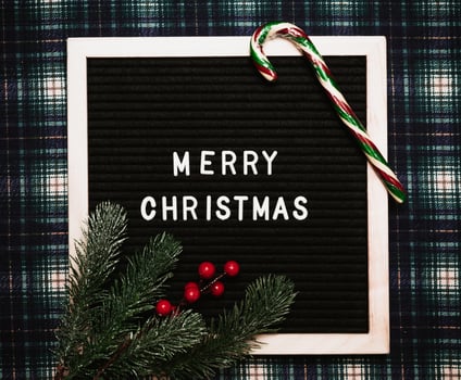 Merry Christmas lettering in plastic letters on an old vintage letter board. Top view. Flatley. Christmas greeting card. photo