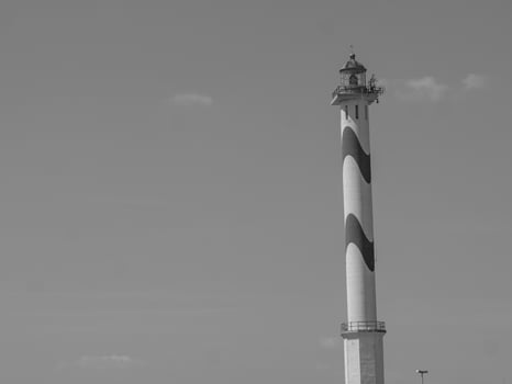 A black and white photo of a lighthouse in belgium