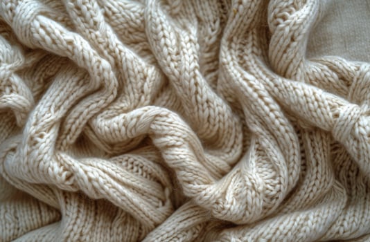 Close Up of Beige Knitted Fabric Texture photo