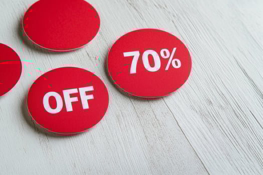 Seasonal discount sale stickers with 70 percent off displayed on a clean white background photo