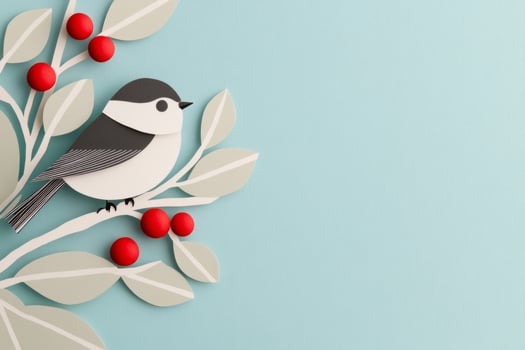 A winter bird perched gracefully on a snowy branch with red berries against a soft blue background photo