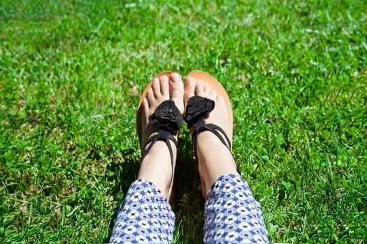 feet in green grass photo