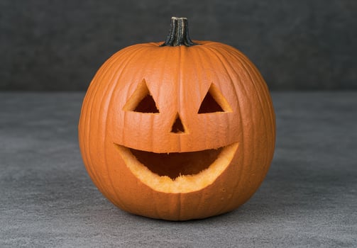 Carved halloween pumpkin with jack o lantern face photo