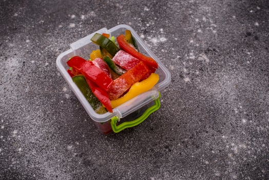 Frozen sliced colorful bell peppers photo