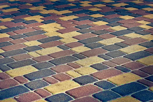 Paving tile colored stones. Cobblestone pavement photo