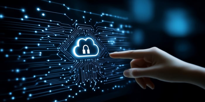 A hand interacts with a modern touch screen displaying symbols of cloud storage security and network connections, set against a deep blue backdrop, showcasing technologys captivating visuals photo