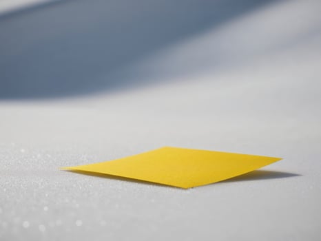 A yellow sticky note on the snow photo