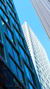 low-angle view a modern building with blue glass windows photo