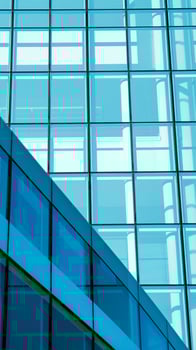 modern glass building with a grid photo