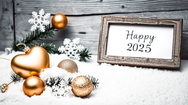 gold baubles snowflakes decorate a happy 2025 sign photo