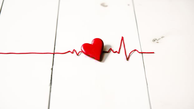 red heart charm with heartbeat string photo