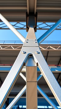close- shot a silver metal support beam a modern structure. photo