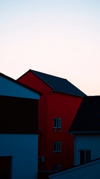 crimson building under a blue sky photo