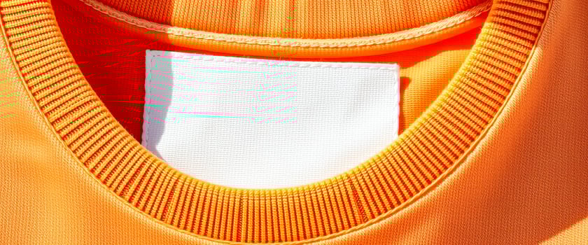 blank white label sewn on an garment photo