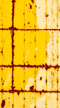 rusty yellow metal surface photo