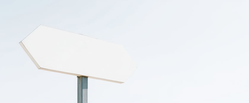 blank hexagonal sign against a pale blue sky photo