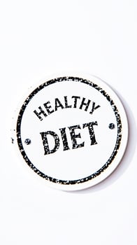 white circular sign with the words healthy diet black letter photo