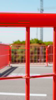 close- a bright red metal barrier photo