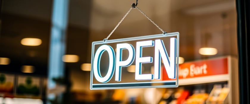 hanging open sign a store window photo