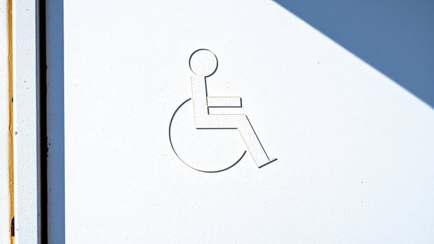 simple white silhouette a person a wheelchair photo
