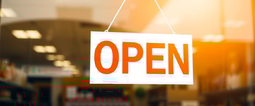 open sign hangs on a door photo
