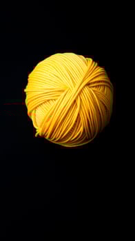 single ball yellow yarn photo