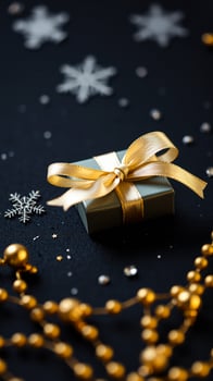 gray gift box with a gold bow festive decor photo