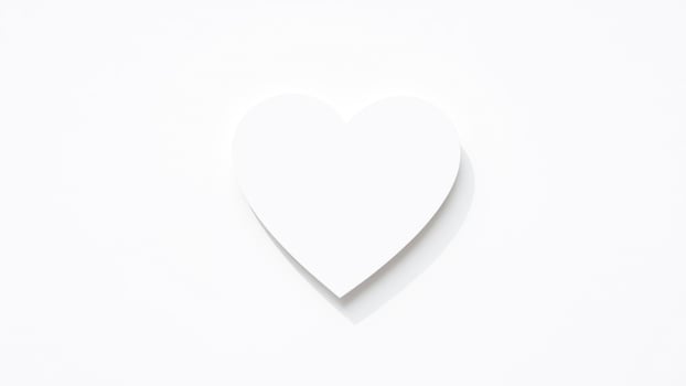 simple white heart shape on a white background photo