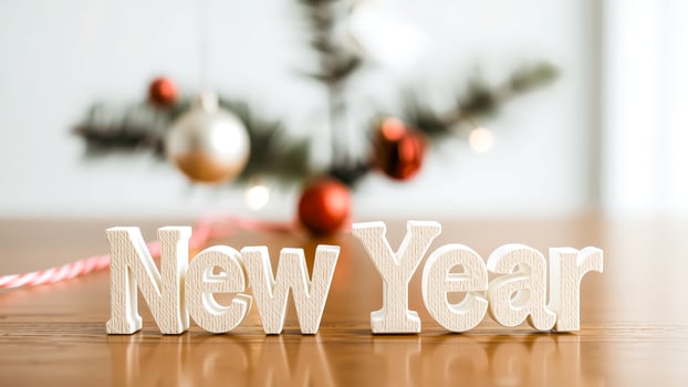 close white wooden letters spelling 'new year' photo