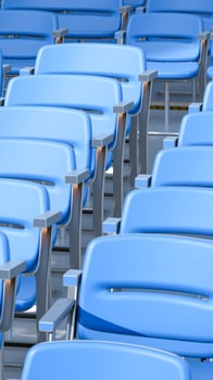 row blue seats with silver armrests photo