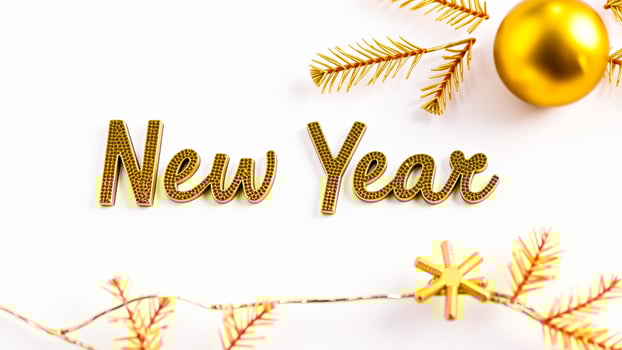 golden new year letters with festive decor photo