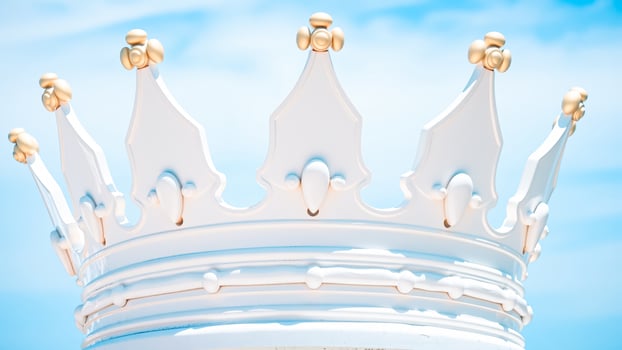white crown stands tall against a blue sky photo