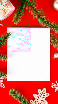 white card with pine sprigs snowflakes on red background photo