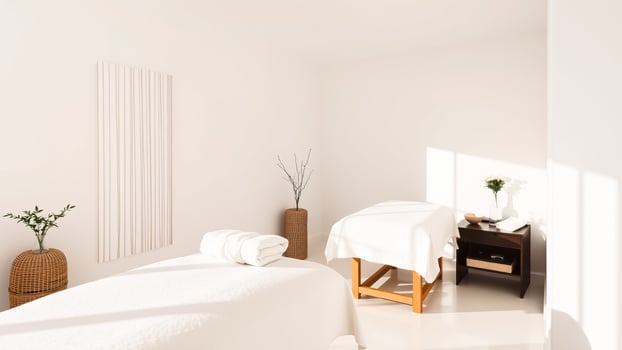 minimalist treatment room with a white table wooden stool photo