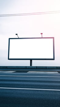 blank billboard awaits a message on a highway photo