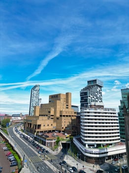 High Angle View of Historical and Modern British City Centre of Liverpool, Maritime city in northwest England, United Kingdom. Aerial Footage Was Captured with Drone's Camera on May 5th, 2024 photo