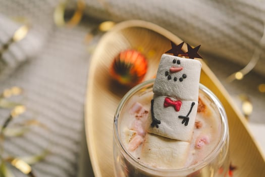 Marshmallow snowman decorated with festive accessories photo